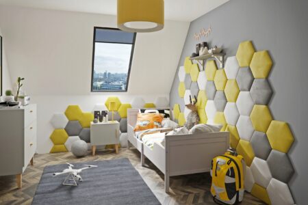 Modern attic child's bedroom with hexagon shape upholstered wall panels